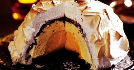 Chocolate orange bombe Alaska with hot chocolate sauce