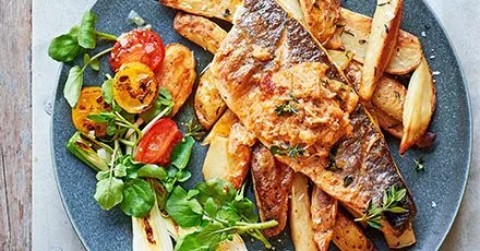 Grilled sea bass, crisp potato skins & crab butter