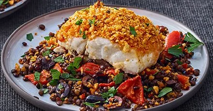 Harissa-crumbed fish with lentils & peppers