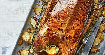 Honey-glazed spiced roast goose & confit potatoes