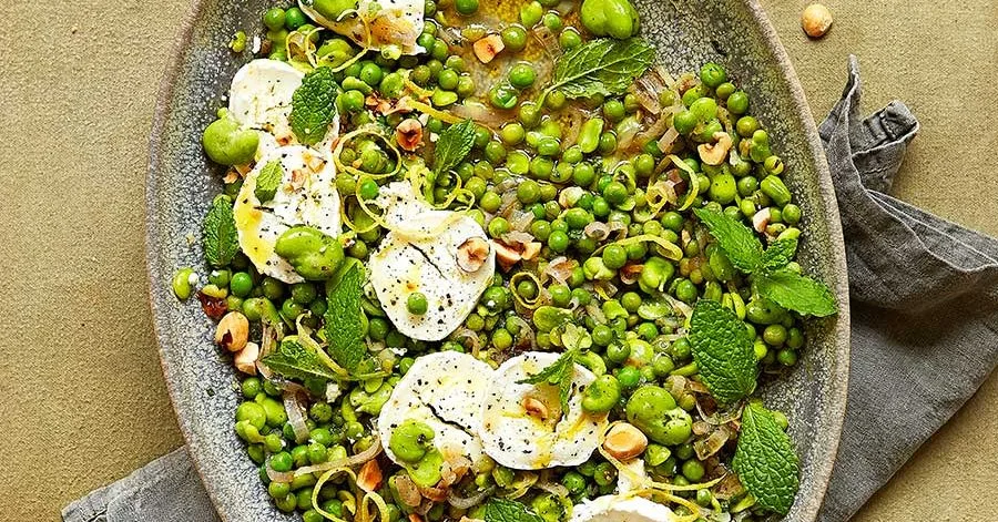 Lemony broad beans with goat's cheese, peas & mint
