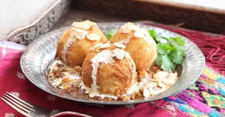 Malai kofta with spicy gravy