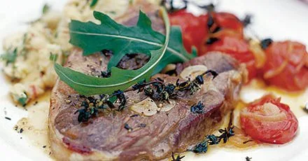 Marinated lamb steaks with paprika roast tomatoes & butterbean smash