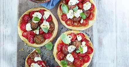 Tomato tarts with roasted garlic & goat’s cheese